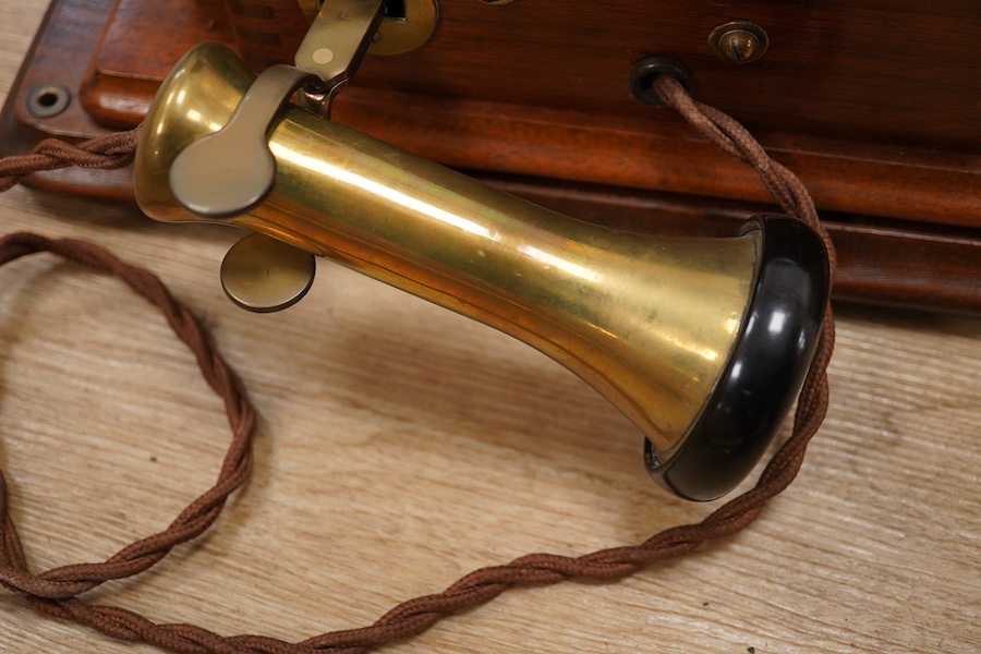 A 1920s walnut wall mounted GPO Model 121 telephone, Patent no.178938. Condition - good.